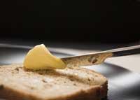 Spreading margarine on bread