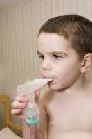 A child using an asthma inhaler