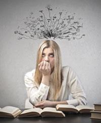 A woman surrounded by books and thinking