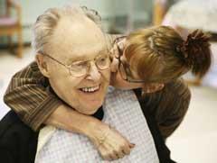 A woman kissing an old man - Methylene blue offers hope to Alzheimer's disease patients