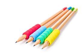 Four pencils with different coloured grips