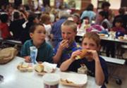 Children eating packed lunch