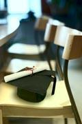 A graduation cap on a chair
