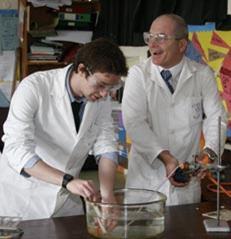 A teacher and student enjoying a practical experiment