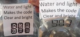 Side-by-side images showing: LEFT, a riddle and hidden clue on a laminated overhead projector sheet; RIGHT, the same sheet dipped in water revealing the code 