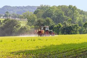 Tractor spraying fertiliser