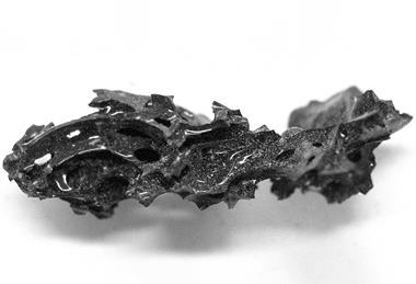 A piece of black glass in an odd shape