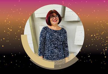 A photograph of Professor Gita Sedghi, surrounded by a pink, gold and black border