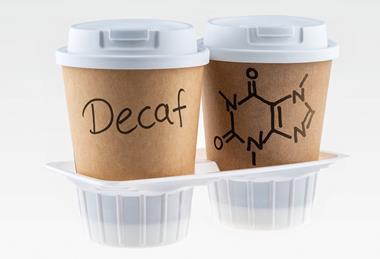 A photo of two take-away coffee cups 