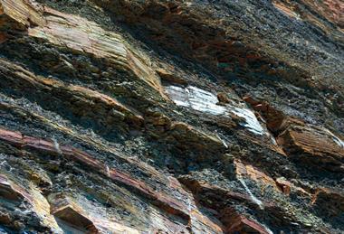 A photograph showing layers of rock in the cliffs at Kimmeridge Bay in Dorset, UK