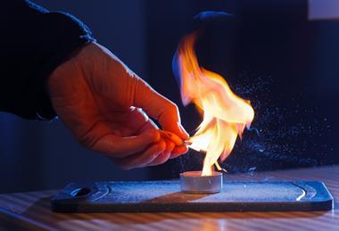 An image of juice from a piece of orange peel burning