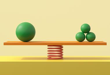 An image showing a balance with one big green ball on one side and three green smaller balls on the other