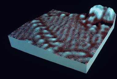 A digital image created using a scanning tunnelling microscope, representing atomic level objects as raised areas and patterns on a surface