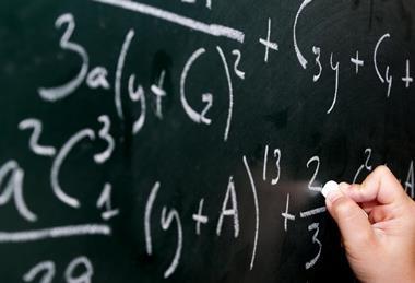 Mathematical equations on a blackboard