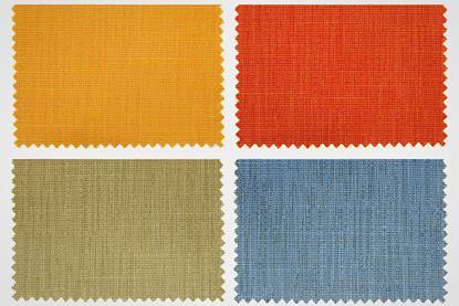 Four different coloured fabric swatches, including yellow, red, green and blue