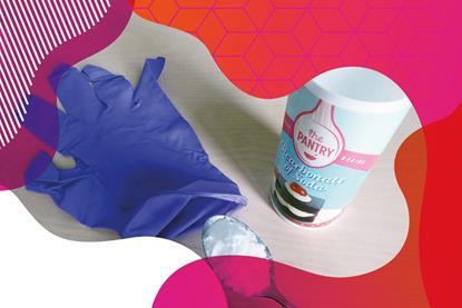 Photo of bicarbonate of soda, a teaspoon and a purple plastic glove