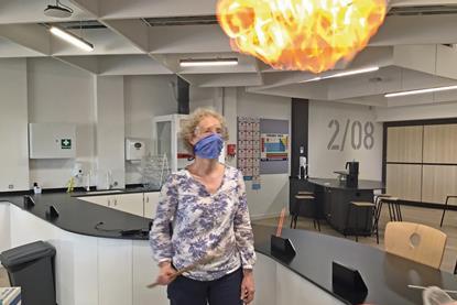 A chemistry teacher creating a fireball in a school lab