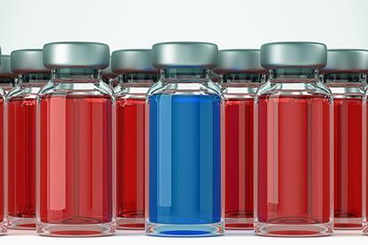 several ampules containing a red solution and one containing a blue solution