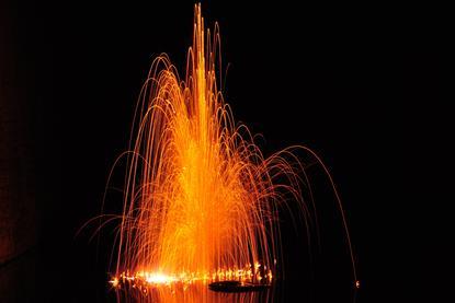A photograph showing an explosive reaction between potassium, an alkali metal, and water