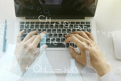hands on a laptop with an overlay of chemical symbols