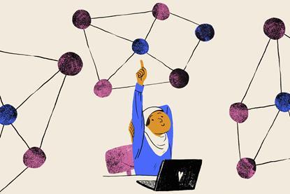 A female student eagerly puts up her hand to answer a question. She is wearing a hijab and is sitting at a desk with a laptop. Above her she points to a chemical structure