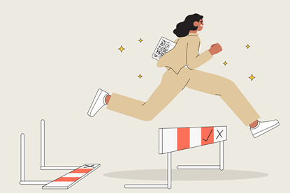A girl jumps over a low hurdle having knocked down the first hurdle