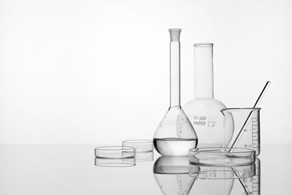 white background, glassware: flasks, beaker, stirring rod, petri dish