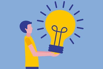 Illustration of person holding a giant bright lightbulb 