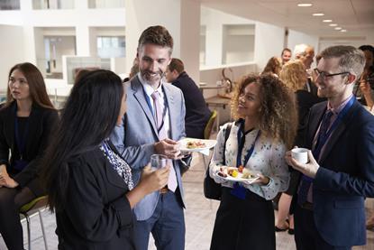 Photograph of delegates networking during conference break