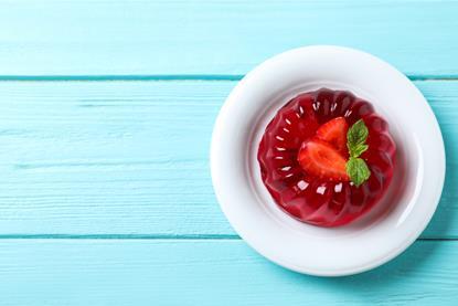 picture of jelly on a plate with a strawberry on the top