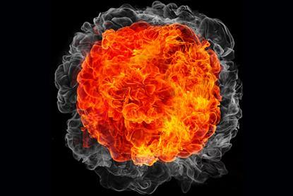 An enhanced image of a red-orange explosion against a dark background