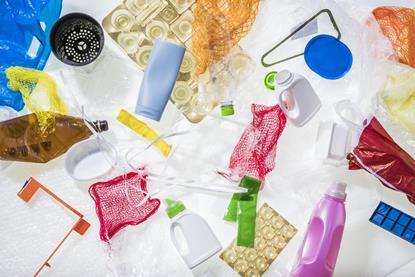 A photograph of different kinds of plastic waste, including bubble wrap, plastic bottles and shopping bags