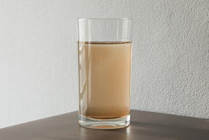 Muddy water in glass image