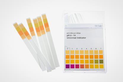 A plastic carton of universal indicator strips with a colour comparison chart