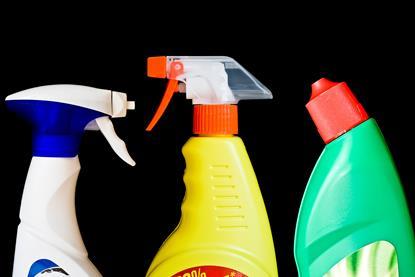 A photo of three household cleaning products' bottles