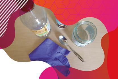 Photo of a jam jar, teaspoon, vinegar bottle and purple plastic glove