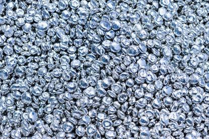 A close-up photograph of a pile of zinc granules