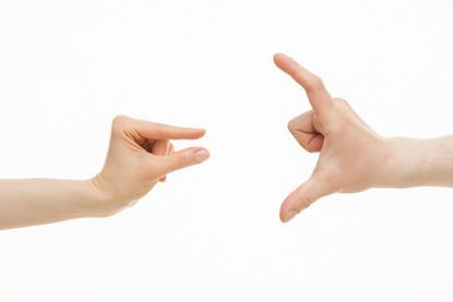 Two hands, one with a small gap between thumb and index finger, the other with a large gap