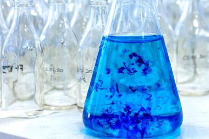 Blue dye in conical flask