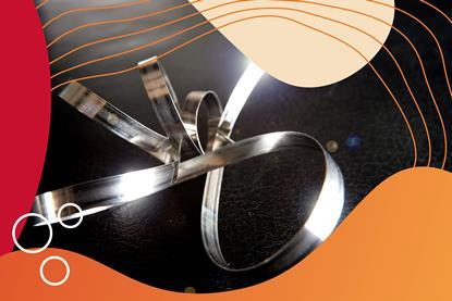 A coiled strip of magnesium ribbon with graphic red-orange surround