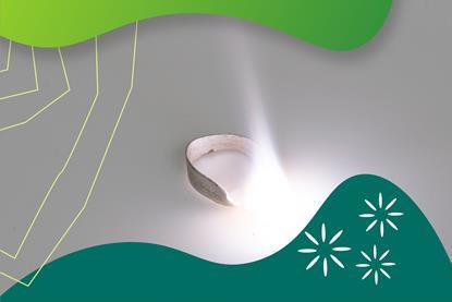 A strip of magnesium is burning in air with a bright white flame with green graphic surround