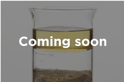 A photograph of a beaker containing a separated mixture of oil, water and sand. Superimposed text reads "Coming soon".