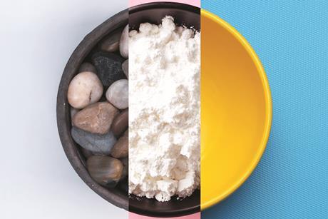 A bowl containing pebbles, another with powdered sugar and an empty bowl