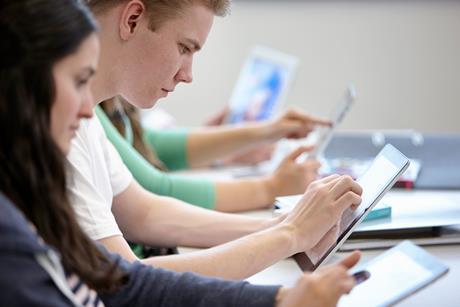 High school students using tablet computers