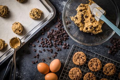 Baking cookies - some of the chocolate chips and flour have been spilled