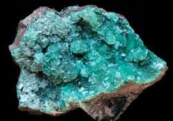 Smithsonite (also known as zinc spar) is usually light green in colour