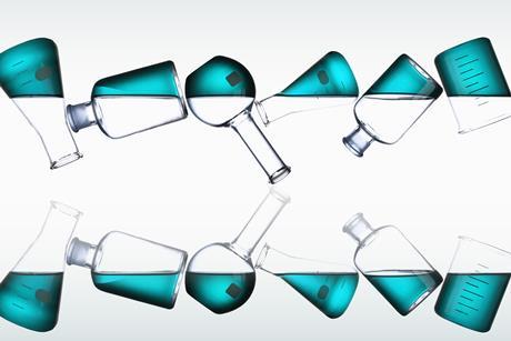 A row of chemistry glassware containing blue liquid, flipped and reflected