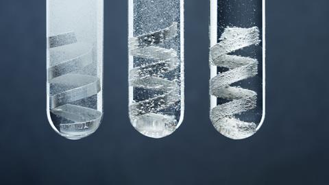 An image showing three test tubes, each containing magnesium strips in hydrochloric acid solutions of different concentrations