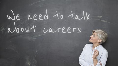 A picture showing a teacher looking at a blackboard with 'We need to talk about careers' written on it