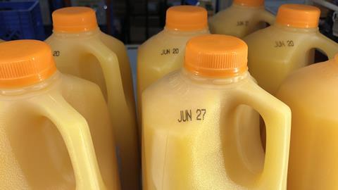 A photo of orange juice bottles with the best before date displayed